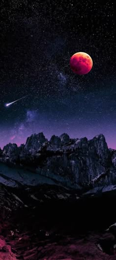 a red moon is seen in the night sky above some rocky mountains and snow capped peaks