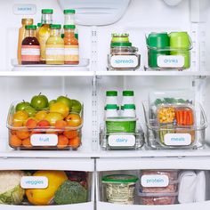 an open refrigerator filled with lots of different types of vegetables and fruit in containers on the shelves