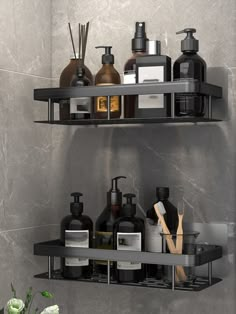 two black shelves with soap, lotion and other bathroom items