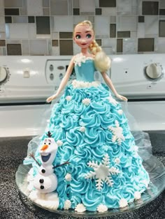 a cake made to look like a frozen princess