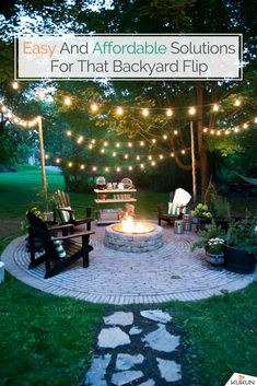 an image of a fire pit in the middle of a yard with lights strung over it