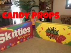 two candy boxes with the words skittles on them in front of a living room