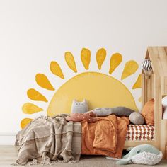 a child's bedroom with sun painted on the wall