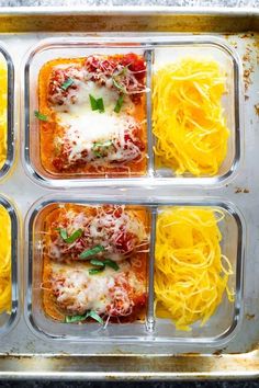 four plastic trays filled with different types of pasta and sauce on top of each other