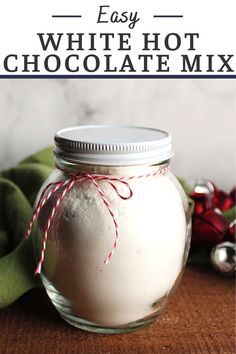 white hot chocolate mix in a glass jar with red and white twine on top