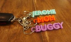 three key chains with the word jerome mom and buggy written on them