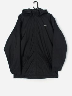 Vintage Nike coat with removable hood. This Y2K Nike coat features a large, thick hood that can be removed (zip). This coat also features a full length zip closure,  two side pockets with zip closures and an inside pocket with a zip closure. The Nike tick is on the front left and is also featured on the back of the jacket. Made from a heavyweight nylon with a nylon lining and a polyester fill.  Our recommended size: Large  Label says: Large  Condition: Good. Tarnishing on the zips. Please see la Streetwear Nylon Parka With Zipper Closure, Winter Zip Fly Hooded Jacket, Winter Hooded Jacket With Zip Fly, Winter Hooded Jacket With Zip Closure, Outdoor Hooded Jacket With Zip Fly, Functional Hooded Outerwear With Zipper Closure, Hooded Windbreaker With Double-lined Hood For Cold Weather, Cold Weather Hooded Windbreaker With Double-lined Hood, Nylon Hooded Jacket With Ykk Zipper