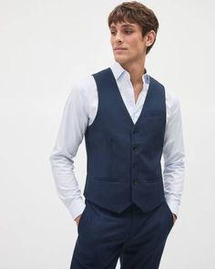 Classic and timeless, this suit vest will complete your suiting look with flair. Ditch your blazer to add an instant retro charm to your 9-to-5 look.

- Slightly stretch
- Welt pockets
- Five-button closure
- Satin back
- Adjustable strap
- Our model wears a size 40 and is 6'2" (1m88) Navy Blue Groomsmen, Blue Groomsmen Suits, Groomsmen Vest, Blue Groomsmen, Navy Suit Wedding, Navy Vest, Groomsmen Suits, Navy Suit, Clothing Men