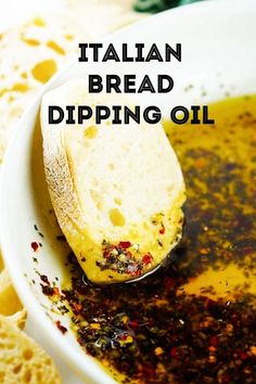 a spoon full of bread dipping oil with the words italian bread dipping oil