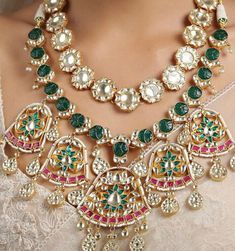 This is a unique set that comes with matching earrings and is in pink and gold finish with beautiful pearl drops. Can be worn on any outfit or for a bridal look as its a complete set of worn for a simple elegant look as well! It's made of high quality stones and kundan and polki work is done with beautiful carved technique. Pink Kundan Temple Necklace With Meenakari, Pink Meenakari Kundan Temple Necklace, Pink Temple Jewelry Necklace With Latkans, Pink Temple Necklace For Wedding And Festive Occasions, Pink Temple Necklace For Festive Wedding, Pink Kundan Temple Necklace For Wedding, Pink Kundan Temple Necklace For Festivals, Traditional Pink Pearl Necklace For Festive Occasions, Pink Temple Necklace For Wedding And Diwali