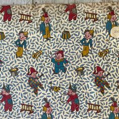 an old fashioned fabric with cartoon characters on it