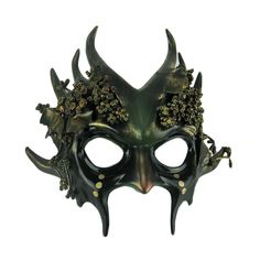 a green mask with horns and flowers on it