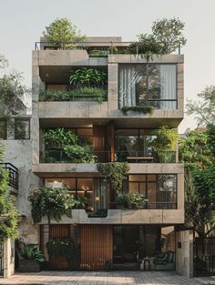 an apartment building with plants growing on the balconies