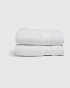 two white towels stacked on top of each other