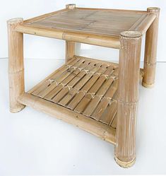 a bamboo coffee table with two shelves on each side