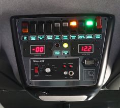 the control panel in this vehicle is lit up with red, green and yellow lights