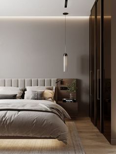 a bedroom with a bed, nightstands and lamps on the wall above it is lit by lights that are hanging from the ceiling