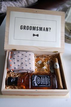 the grooms box is filled with alcohol and toiletries