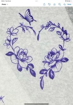 an image of flowers and butterflies in the shape of a heart on top of a towel