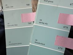 two different shades of blue and pink are on the same sheet of paper that is taped to each other