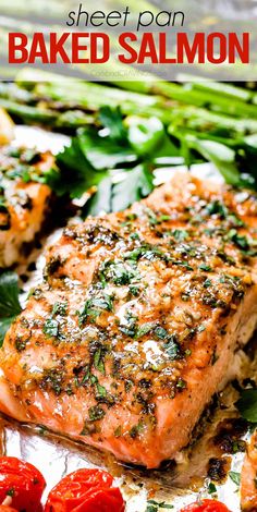 sheet pan baked salmon with tomatoes and spinach on the side for garnish