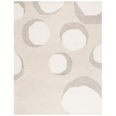 a white rug with grey circles on it