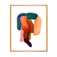 an abstract painting with orange, green and pink colors in a wooden frame on a white wall