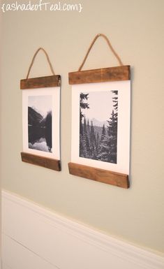 two framed pictures hanging on the wall next to each other