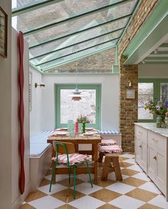 a kitchen with a table and chairs in it