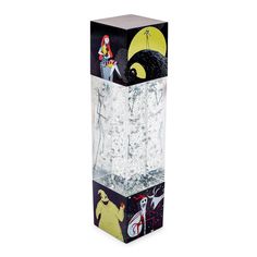 a tall glass vase with an image of people in the night sky on it's sides