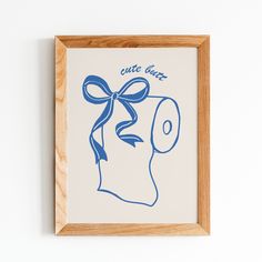 a blue and white drawing with a bow on it's head in a wooden frame