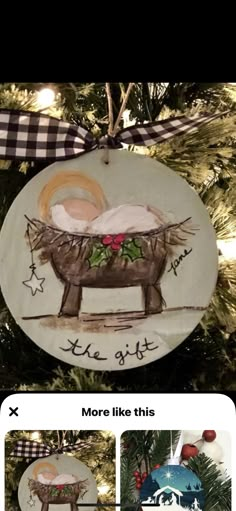 a christmas ornament with a baby's birth in a manger on it