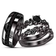 two wedding rings with black diamonds on each one and an engagement ring in the other