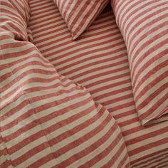 red and white striped bedding with pillows