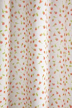 an image of a curtain with red and green flowers on white background, closeup