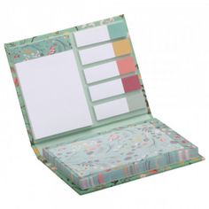 an open box with several different colored papers in the bottom and inside, on a white background