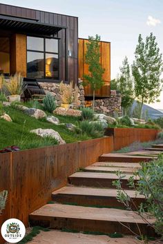 an outdoor garden with steps leading up to the house