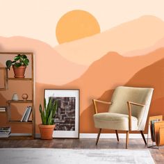 a living room with a chair, bookshelf and potted plant on the floor