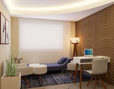 a living room filled with furniture and a laptop computer on top of a white table