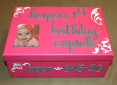 a pink box with a photo on it that says, happy 1st birthday capable open 3509