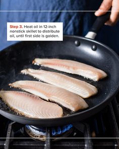 four fish fillets cooking in a skillet on the stove with instructions to cook them