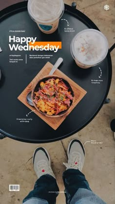 a person standing in front of a table with food and drinks on it that says happy wednesday