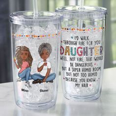 two personalized tumblers sitting on top of a table