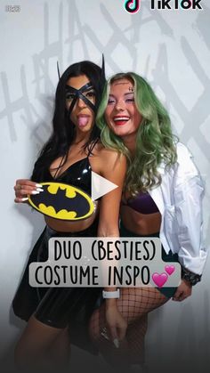 two women dressed up as batman and catwoman