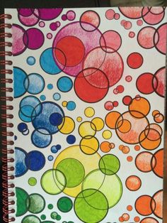 a notebook with colored circles and bubbles on it