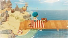 a boy is sitting on a wooden bench in front of the ocean with his luggage