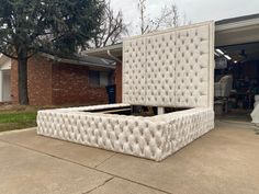 a mattress sitting in the middle of a driveway