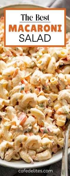 the best macaroni salad in a bowl with a fork