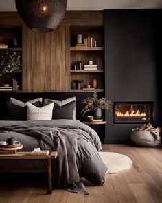 a bed room with a neatly made bed next to a fire place