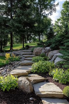 Stone path winding through a lush garden with blooming flowers and large rocks. Rock Slabs Landscaping, Modern Farm Landscape Design, Adirondack Landscaping, Landscaping For Sloped Front Yard, Mountain Style Landscaping, Using Boulders In Landscaping, Deck Ideas For Sloped Backyard, Natural Stone Landscaping, Rock Retaining Wall Sloped Backyard